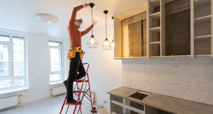 Handyman repairing light