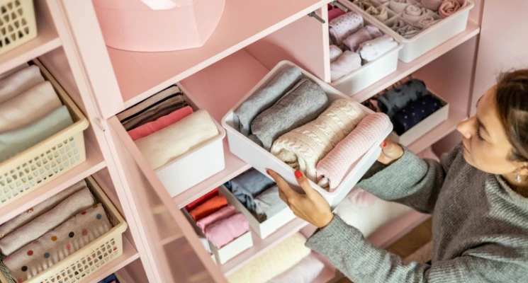 Woman cleaning and organizing Drawer
